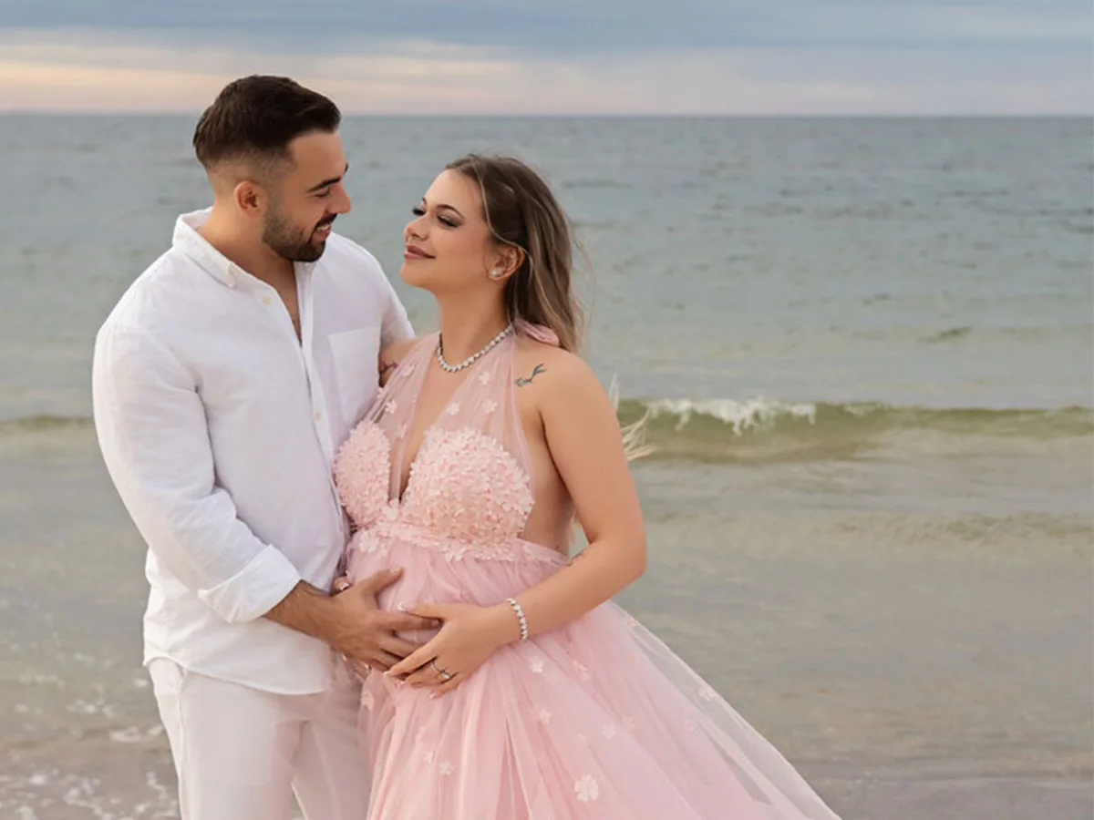 Maternity beach photoshoot in a flowing dress in Kołobrzeg